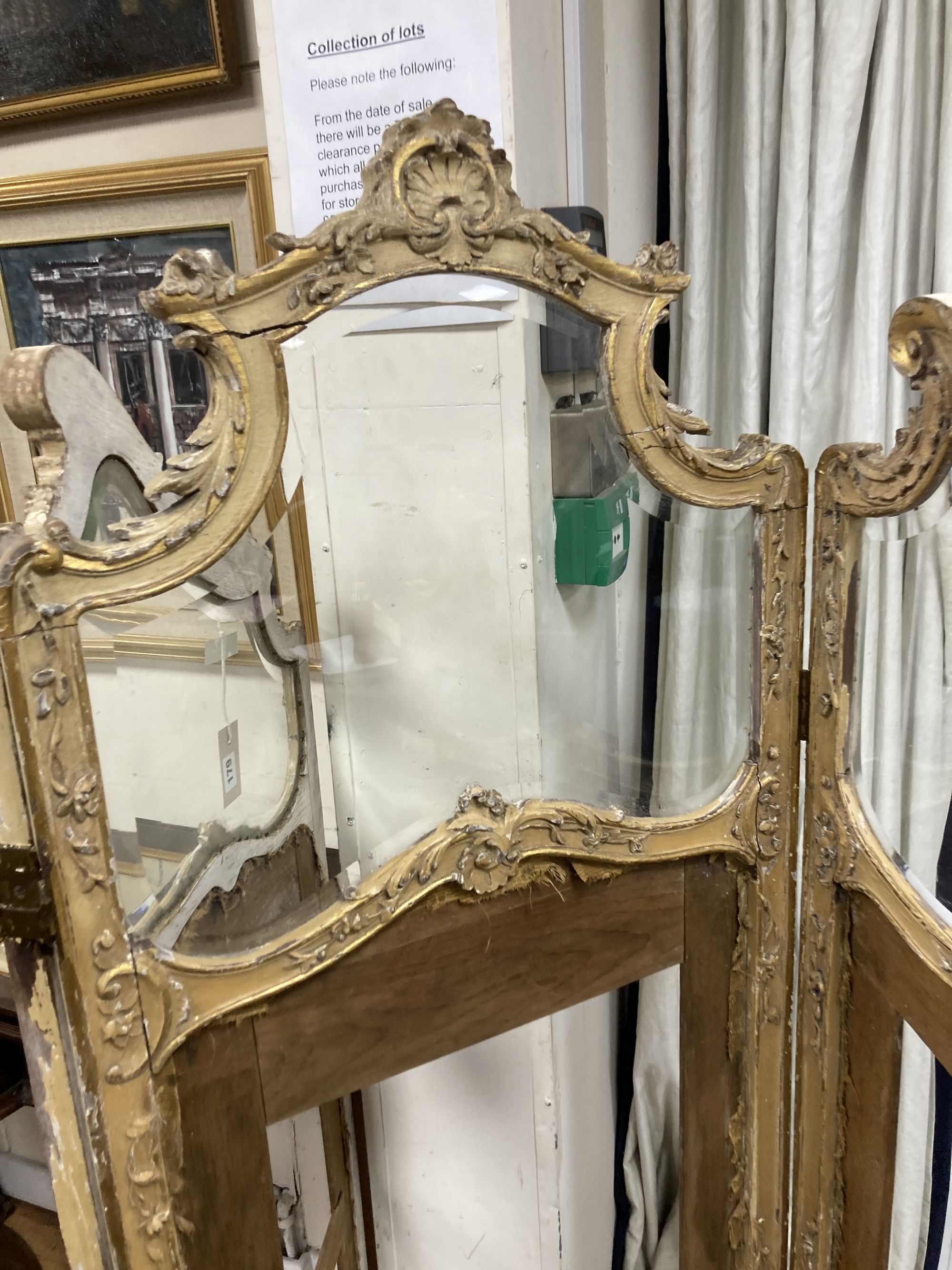 An early 20th century giltwood and gesso part glazed three fold dressing screen, height 172cm